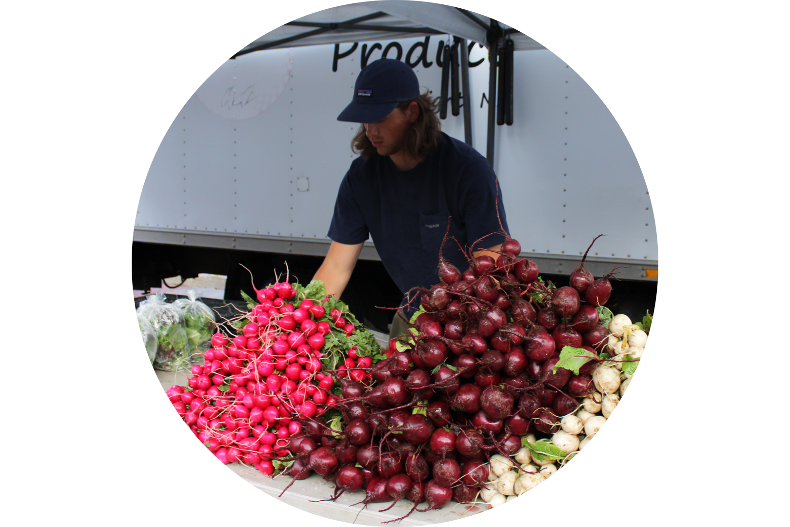 A vegetable booth at a farmers market. Photo by Russell Shaffer